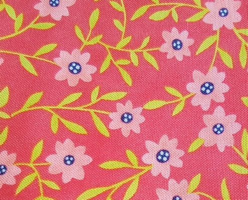 Orange fabric with pink flowers